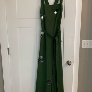 Tory Burch floor length dress with large sequin detail.  Open back and pockets!
